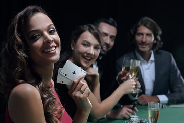 adult group celebrating friend winning blackjack