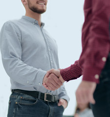 Business people shaking hands in modern conference office.