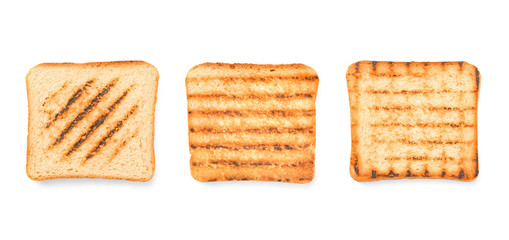 Different tasty toasted bread on white background
