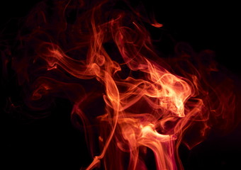 Red smoke on black background