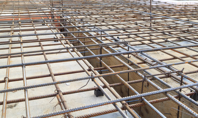 close up view of reinforcement of concrete with metal rods connected by wire. Preparation for...