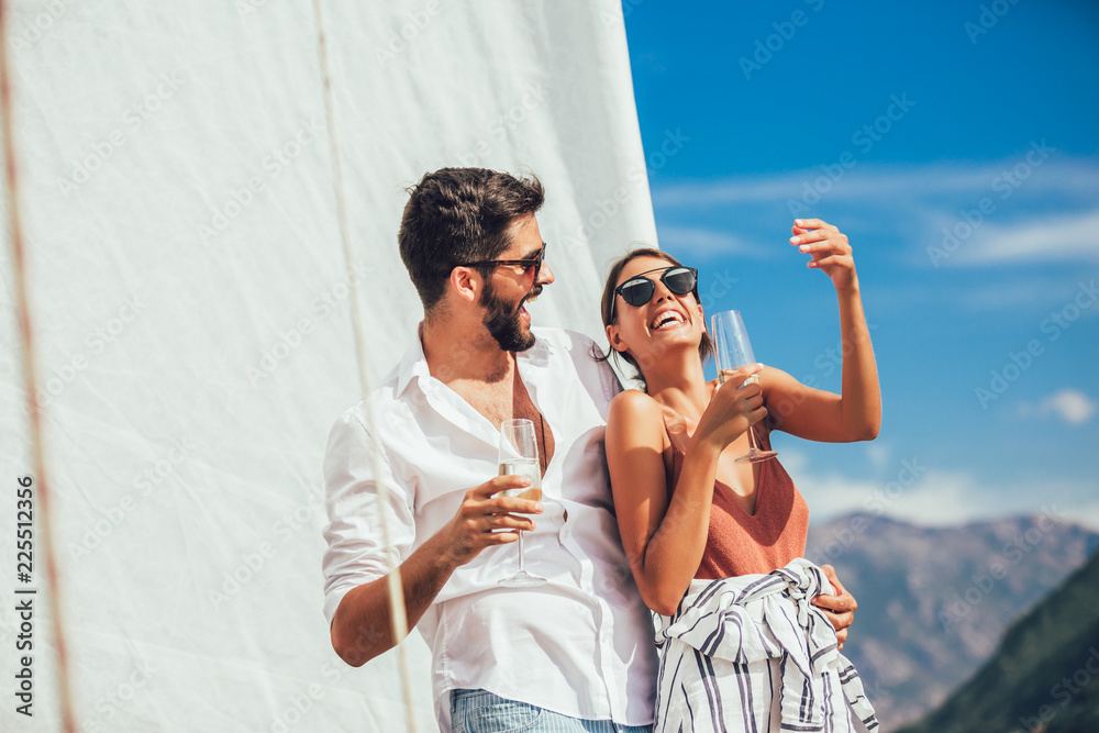 Poster Couple in love on a sail boat in the summer.