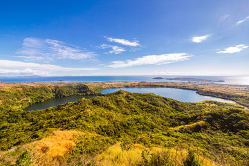 View from Mont Passot above the crater lake Lac Amparihibe and the Indian Ocean, Nosy Be, Madagascar
