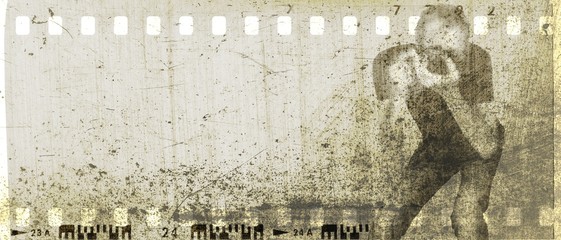 Vintage sepia film strip frame with figure of photographer at work.