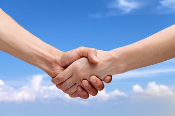 Business handshake of business people on background