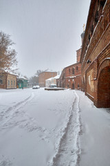 The Cathedral of the Dormition in krutitskoe metochion in Moscow. There is heavy snowfall in the city.