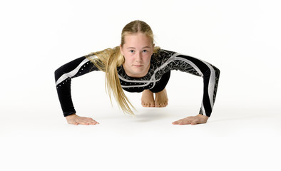 Young teen girl gymnastic on white background