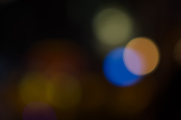 Abstract city night defocused light, blur bokeh, colorful & dark background. Backdrop, street, artistic & shiny.