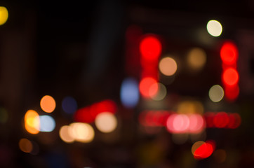 Abstract city night defocused light, blur bokeh, colorful & dark background. Street, shiny, backdrop & pattern.