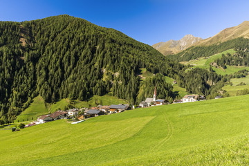 Fototapeta na wymiar Lappago (Lappach) in Summer Time a beautiful and characteristic Alps Town situated in Valley Aurina