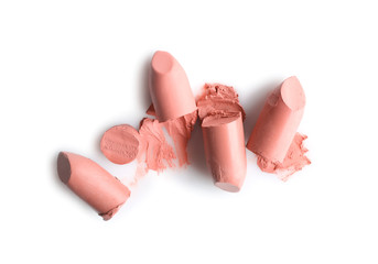 Light lipsticks on white background