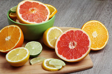 Fototapeta na wymiar Mix of citrus fruits cut in different forms