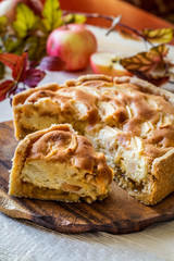 Apple pie on wooden chopping Board on white background