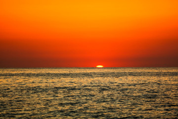 Obraz premium Rays of sunset on the black sea
