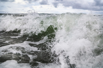 Storm waves on the seashore as a background