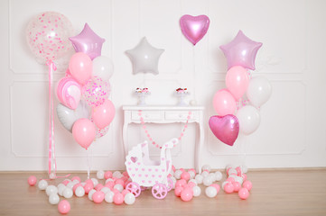 Decorations for children birthday. Decorations for holiday party. A lot of balloons pink and white colors. 