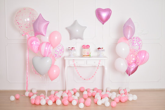 Children birthday. Decorations for girl birthday. A lot of balloons pink and white colors. 