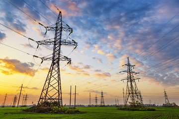 High voltage power lines at the sunset.