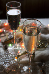 The glasses of champagne and christmas decoration.	