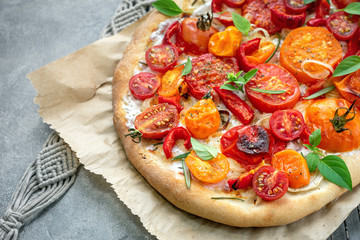 Tomato pizza with ricotta cheese.