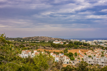 Scenic landscape of houses on the background of a calm blue sea horizon