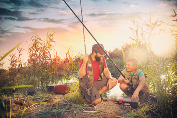 Happy father and son ready for fishing - obrazy, fototapety, plakaty