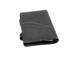 Black leather business diary isolated on white background