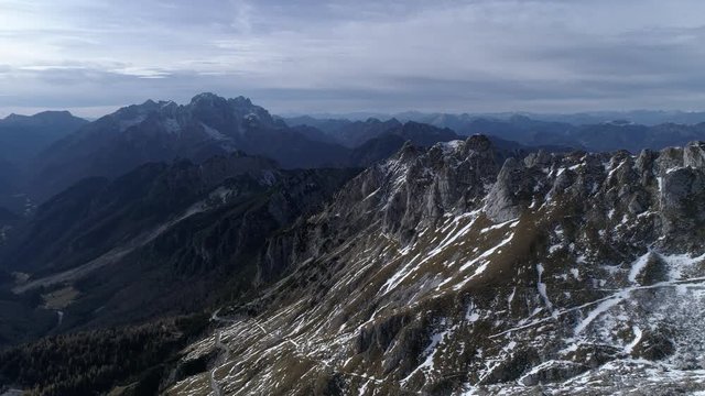 Aerial - Flying over Alpine landscape with mountains in autumn
