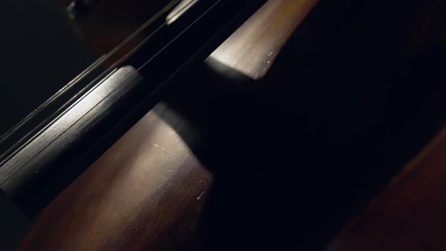 The cellist performs on stage.