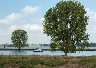River landscape with small cruiser