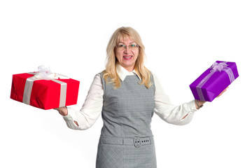 Senior woman with gifts boxes in her hands on a light background.