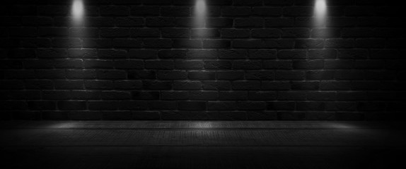 Background of an empty dark-black room. Empty brick walls, lights, smoke, glow, rays