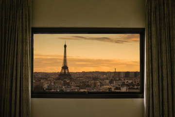 Curtain interior decoration in living room, Eiffel as seen through window.