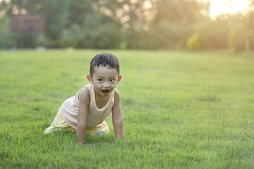 Happy child with dandelions in the countryside at springtime. Concepts of family, healthy lifestyles and happiness.