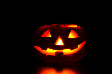 carved from Jack's pumpkin lantern for Halloween party on dark background
