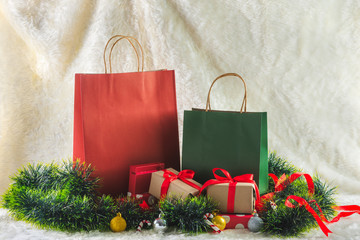 shopping bag and gift boxes decorated with ornaments on wool