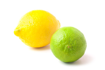 Close up of fresh green lime and lemon isolated on white