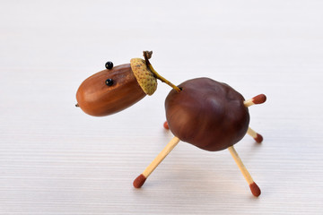 Animal figurine made of chestnuts and acorns