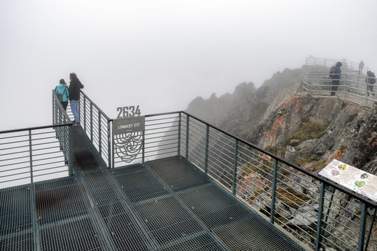 Tourists on top of the peak Lomnicky stit, Slovakia