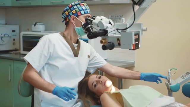 The girl is on dental treatment with special intraoral check. 4K
