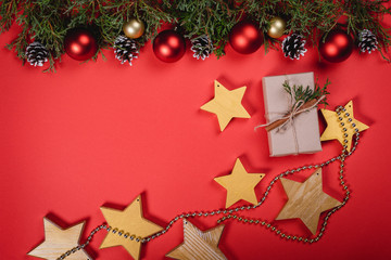 Christmas and New Year holidays. background. Christmas card with copy space. Stylish branding mockup to display your artworks. Cute vintage christmas new year gifts mock up on red background.