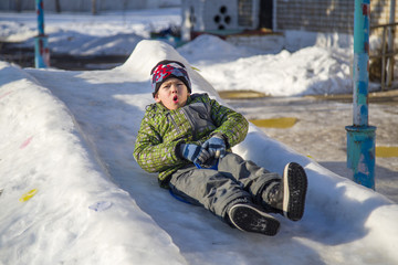 boy riding on a hill in winter © vitec40