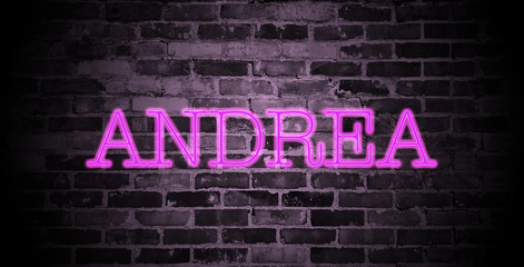 first name Andrea in pink neon on brick wall