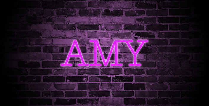 first name Amy in pink neon on brick wall