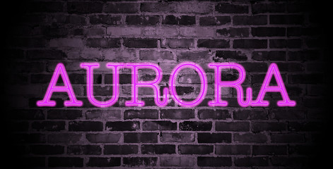 first name Aurora in pink neon on brick wall