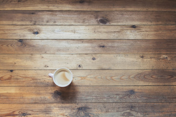 Cup of coffee on a wooden table. Winter concept