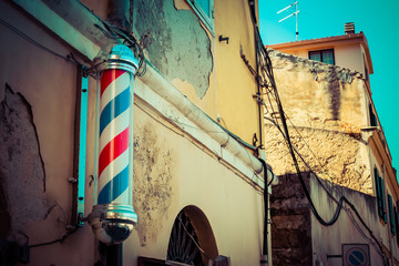 old barber shop with barber pole