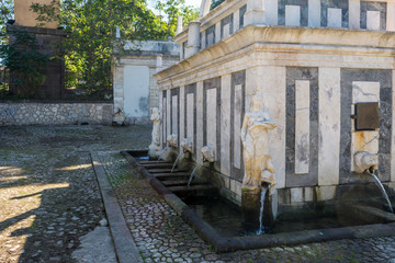 Detail of ancient fountain in the middle of the city