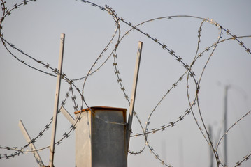 new modern barbed wire against the sky