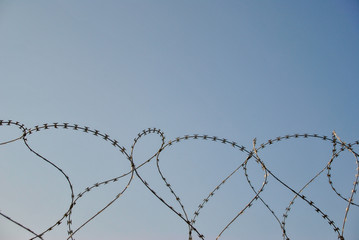 new modern barbed wire against the sky